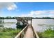 Private lakefront dock with stairs and floating platform at 6245 Little Lake Sawyer Dr, Windermere, FL 34786