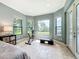 Bright home gym with lake views and room for exercise equipment at 6245 Little Lake Sawyer Dr, Windermere, FL 34786