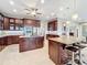 Gourmet kitchen boasts granite countertops, stainless steel appliances, and ample cabinetry at 6245 Little Lake Sawyer Dr, Windermere, FL 34786