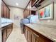 Laundry room with granite countertops, cabinets, and a sink at 6245 Little Lake Sawyer Dr, Windermere, FL 34786