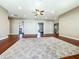 Spacious living area with hardwood floors and access to multiple bedrooms at 6245 Little Lake Sawyer Dr, Windermere, FL 34786