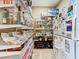Well-organized pantry with ample shelving for storage at 6245 Little Lake Sawyer Dr, Windermere, FL 34786