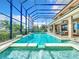 Spacious pool and spa with screened enclosure and lake view at 6245 Little Lake Sawyer Dr, Windermere, FL 34786