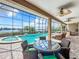 Enjoy this amazing pool and spa with a view, screened enclosure, and outdoor dining at 6245 Little Lake Sawyer Dr, Windermere, FL 34786
