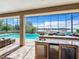 Inviting pool and spa with outdoor kitchen and lake view at 6245 Little Lake Sawyer Dr, Windermere, FL 34786