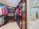 Organized walk-in closet with custom shelving and drawers at 6245 Little Lake Sawyer Dr, Windermere, FL 34786