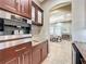 Built-in coffee maker in a wet bar with granite countertop at 6245 Little Lake Sawyer Dr, Windermere, FL 34786