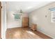 Light-filled bedroom with wood flooring and built-in wooden wardrobe at 7710 Tern Dr, Orlando, FL 32822