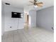 Simple living room with tile floors and ceiling fan at 7710 Tern Dr, Orlando, FL 32822