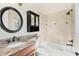 Bathroom with granite countertop, dark wood vanity, and shower/tub combo at 805 Hamilton Place Ct, Winter Park, FL 32789