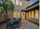 Brick patio with a round table and chairs set against the house at 805 Hamilton Place Ct, Winter Park, FL 32789