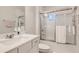 Modern bathroom offers a shower/tub combo, vanity with sink, and a linen closet at 8192 Ludington Cir, Orlando, FL 32836