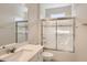 Bright bathroom boasts a shower/tub combo, vanity with sink, and a large mirror at 8192 Ludington Cir, Orlando, FL 32836
