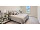 Serene bedroom with king-size bed, nightstands, and large window at 8192 Ludington Cir, Orlando, FL 32836