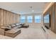 Spacious media room featuring a large sectional sofa and a wall-mounted TV at 8192 Ludington Cir, Orlando, FL 32836