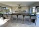 Modern outdoor kitchen with a large island and bar seating at 8192 Ludington Cir, Orlando, FL 32836
