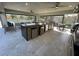 Luxury outdoor kitchen with built-in appliances and plenty of seating at 8192 Ludington Cir, Orlando, FL 32836