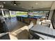 Spacious outdoor kitchen with stainless steel appliances and seating area at 8192 Ludington Cir, Orlando, FL 32836
