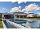 Luxury home with a large pool and a beautiful outdoor kitchen at 8192 Ludington Cir, Orlando, FL 32836