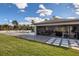 Expansive backyard oasis with a large pool, patio, and outdoor kitchen at 8192 Ludington Cir, Orlando, FL 32836