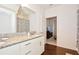 Bright bathroom with double sinks, granite countertop, and linen closet at 8953 Shine Dr, Kissimmee, FL 34747