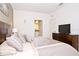 Primary bedroom with king bed and ensuite access at 8953 Shine Dr, Kissimmee, FL 34747