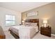 Primary bedroom with king bed and neutral decor at 8953 Shine Dr, Kissimmee, FL 34747
