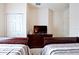 Bedroom with two twin beds and shared dresser at 8953 Shine Dr, Kissimmee, FL 34747