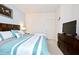 King-size bedroom with TV and dresser at 8953 Shine Dr, Kissimmee, FL 34747