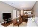 Spacious living room with neutral decor, and views into dining and kitchen areas at 8953 Shine Dr, Kissimmee, FL 34747
