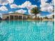 Resort-style pool with clubhouse in the background at 8953 Shine Dr, Kissimmee, FL 34747