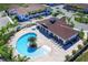 Community pool with clubhouse and lounge chairs at 8953 Shine Dr, Kissimmee, FL 34747