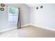 Well-lit bedroom featuring a window with gray curtains at 1005 Cherry Valley Way, Orlando, FL 32828