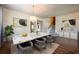 Modern dining room with marble table and hardwood floors at 1164 Liberty Hall Dr, Kissimmee, FL 34746