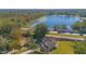 Aerial view of house near lake with large backyard at 1250 Woodridge Ct, Altamonte Springs, FL 32714