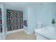 Bathroom with patterned shower curtain and white vanity at 1250 Woodridge Ct, Altamonte Springs, FL 32714