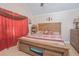 Large bedroom with wooden bed frame and red bedding at 1250 Woodridge Ct, Altamonte Springs, FL 32714