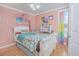 Charming bedroom with a white bed frame and colorful decor at 1250 Woodridge Ct, Altamonte Springs, FL 32714