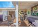 Outdoor bar and seating area on a deck, adjacent to interior living space at 1250 Woodridge Ct, Altamonte Springs, FL 32714