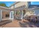 Covered deck with a built-in bar and seating area, leading to interior living space at 1250 Woodridge Ct, Altamonte Springs, FL 32714