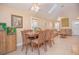 Dining area with a large wooden table and six chairs at 1250 Woodridge Ct, Altamonte Springs, FL 32714