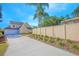 Long driveway leading to a two-story house with a fenced backyard at 1250 Woodridge Ct, Altamonte Springs, FL 32714