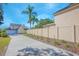 Long driveway leading to a two-story house with a fenced backyard at 1250 Woodridge Ct, Altamonte Springs, FL 32714