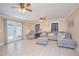 Bright and airy living room with comfortable seating and tile floors at 1250 Woodridge Ct, Altamonte Springs, FL 32714
