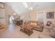 Bright living room with a large sofa and tile floor at 1250 Woodridge Ct, Altamonte Springs, FL 32714