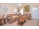 Comfortable living room with brown sofas and tile floors at 1250 Woodridge Ct, Altamonte Springs, FL 32714