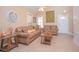 Comfortable living room with brown sofas and tile floors at 1250 Woodridge Ct, Altamonte Springs, FL 32714