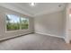 Spacious bedroom with large window and plush carpeting at 1262 Venice Ct, Deland, FL 32724