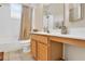 Simple bathroom with a tub shower combo and light wood vanity at 1619 Cherry Blossom Ter, Lake Mary, FL 32746