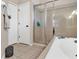 Clean bathroom with a shower and tub, and a separate toilet area at 1619 Cherry Blossom Ter, Lake Mary, FL 32746